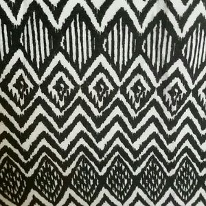 Black and white zig-zag patterned romper