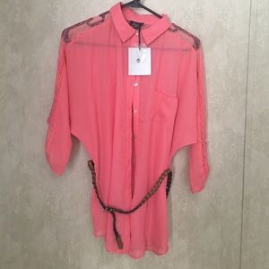 Button up shirt, lace on sides. Never worn