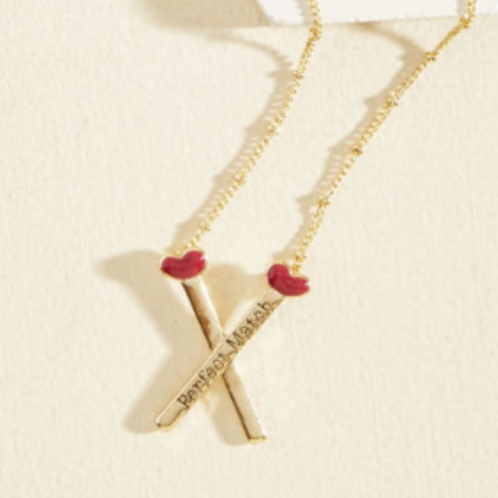 Strike up a romance necklace by modcloth