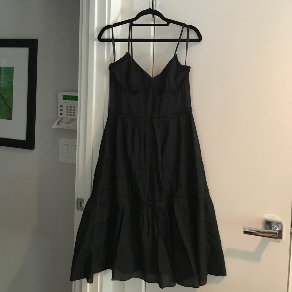Black spaghetti strap dress with ruffle detail