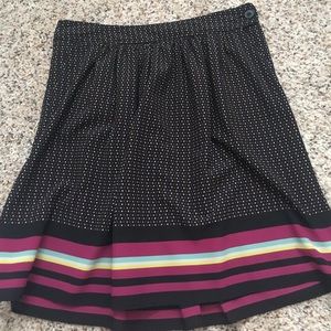 Black skirt with stripes and polka dots.