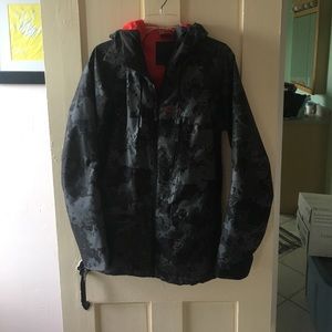 Black grey and red Oakley winter coat