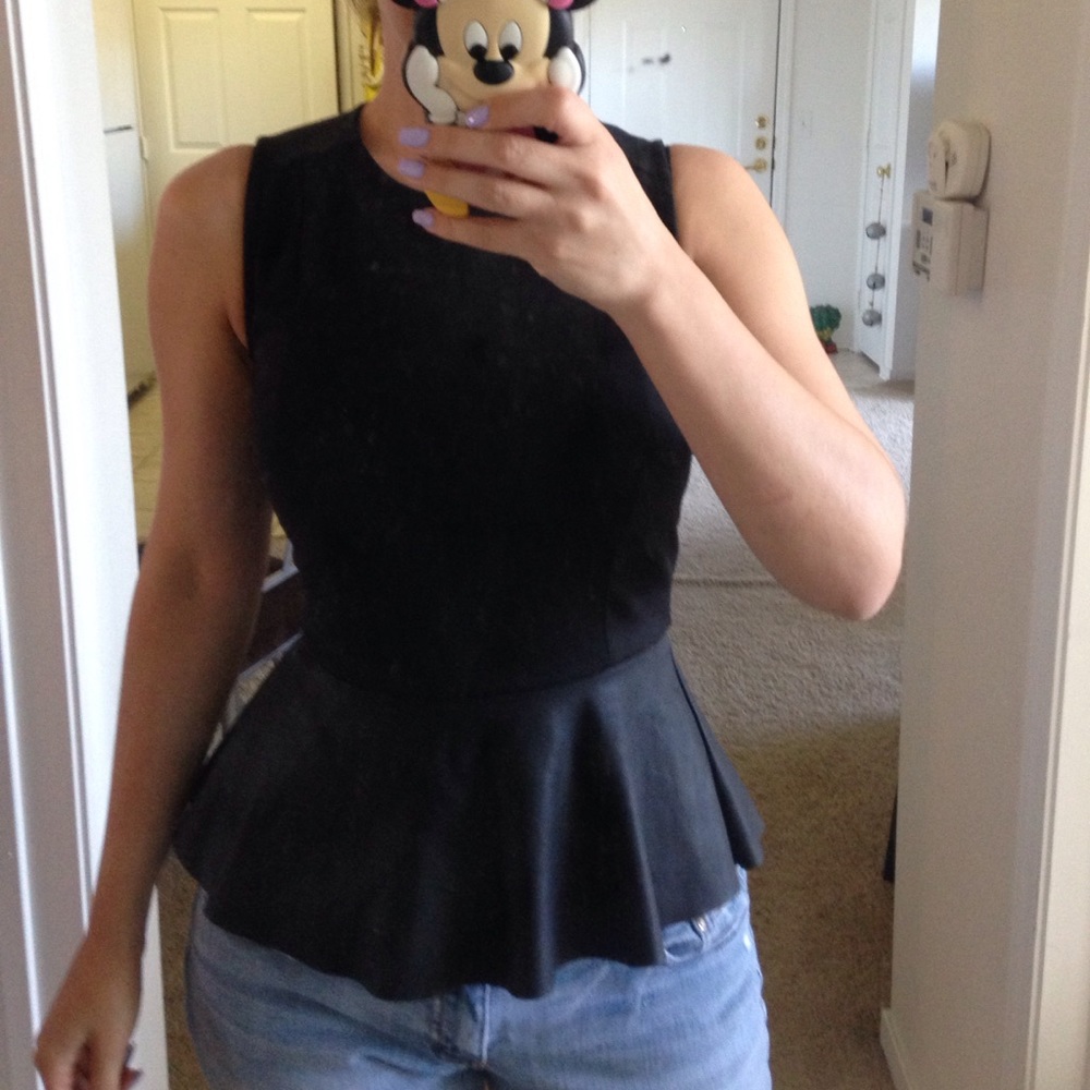 Black peplum top, with faux leather.
