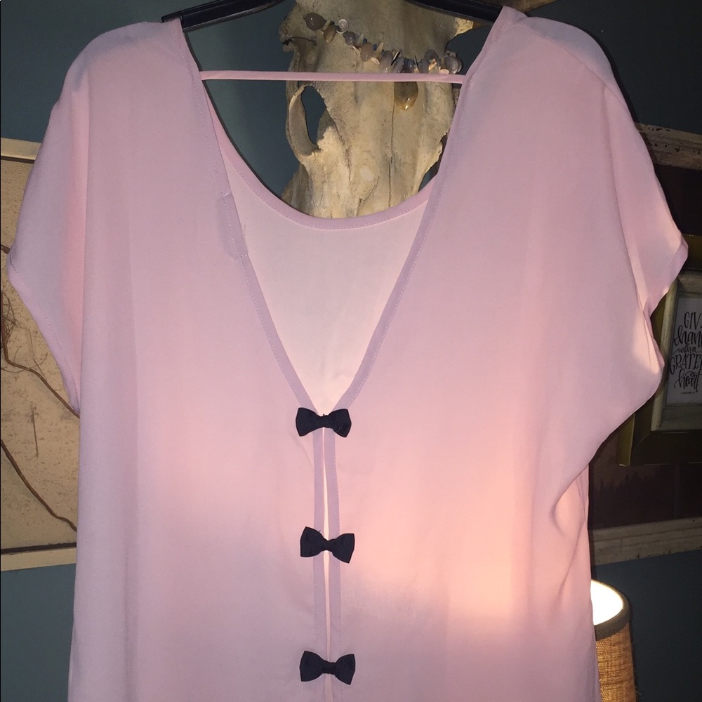 Baby pink top with bows in the back