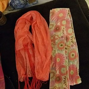 Two scarves, one is orange and one is multicolored