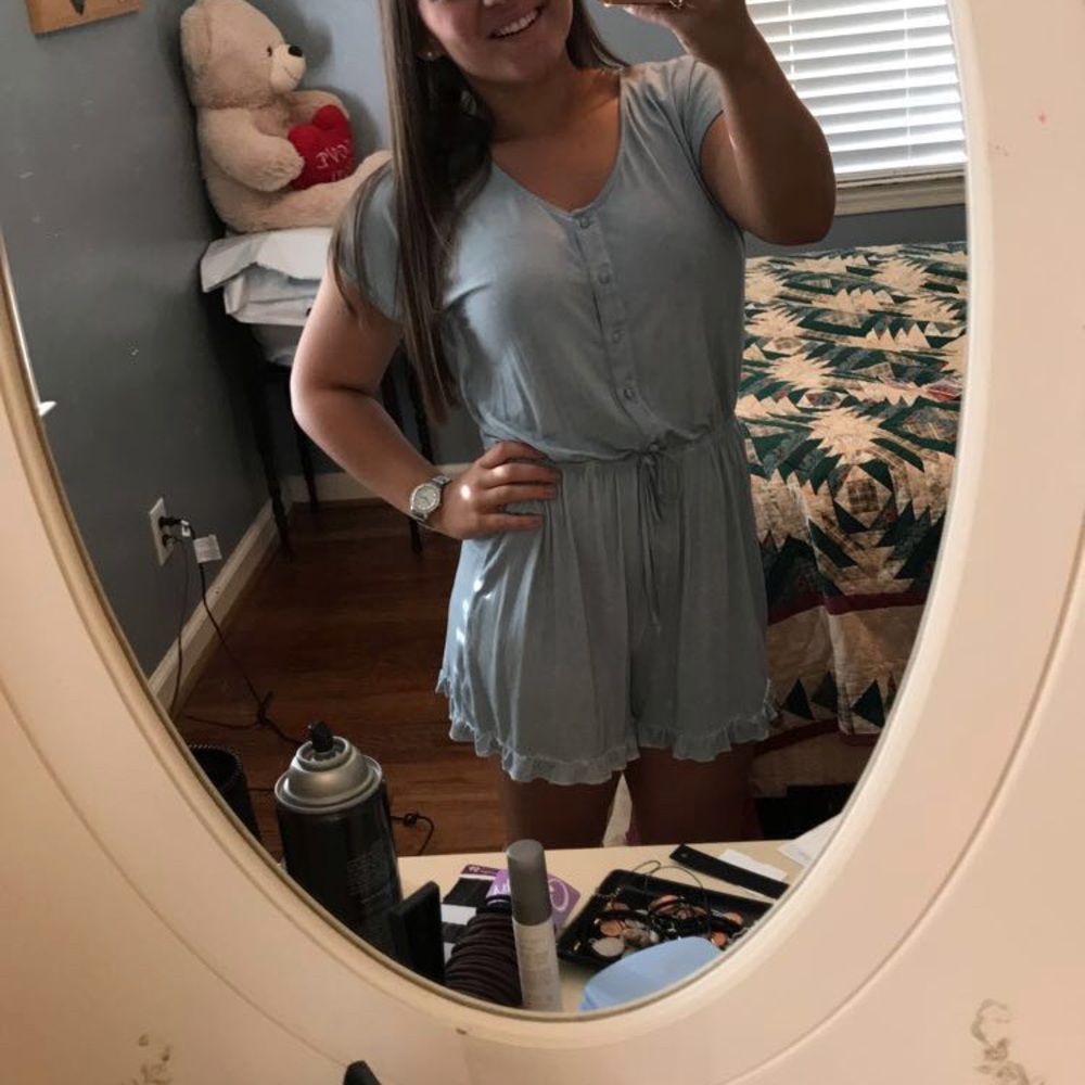 Cute blue button up romper with lace on the back