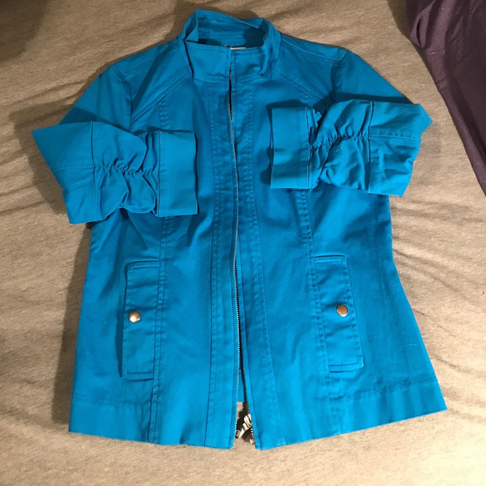 Bright blue zip up jacket.