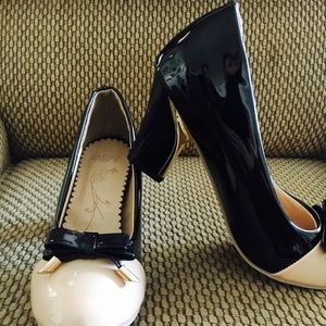 Black and nude pumps