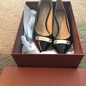Black leather coach heels