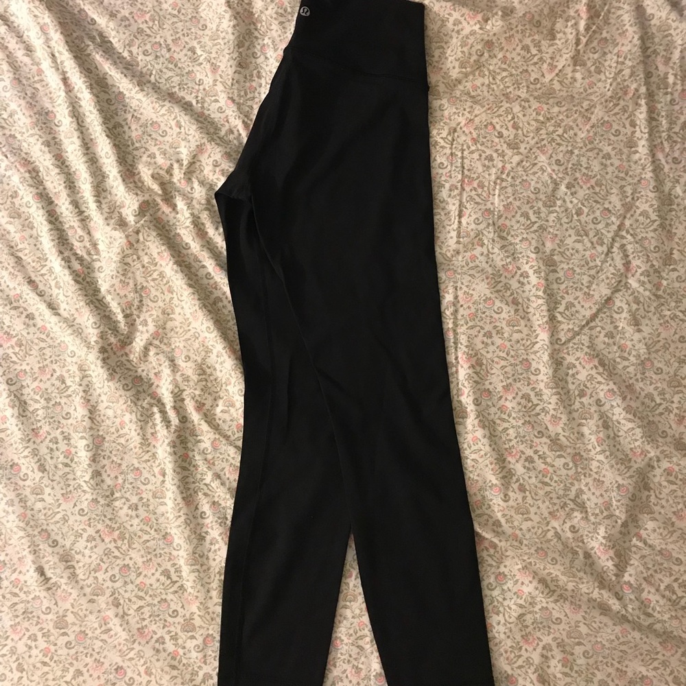 Like new!  Solid black size 6 lululemon high times