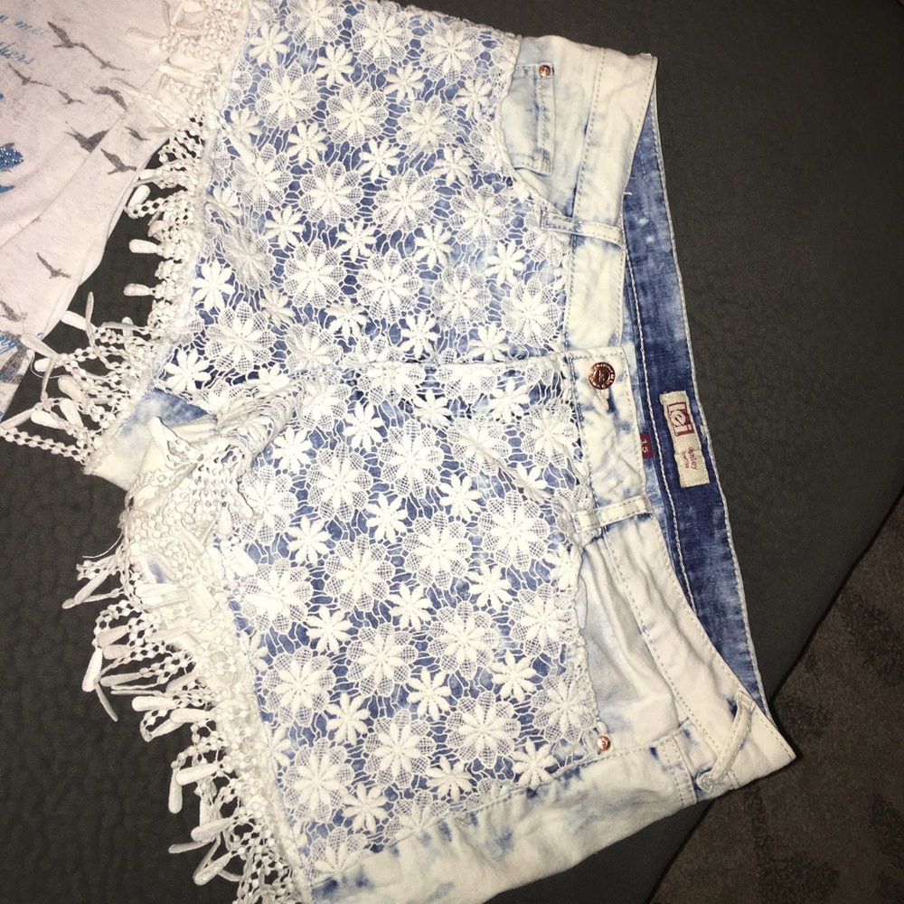 Denim shorts with lace and fringe