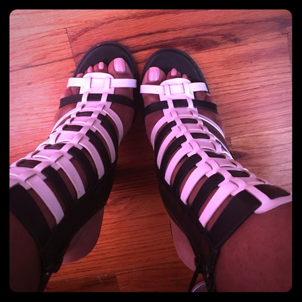 Caged high top heeled sandal.