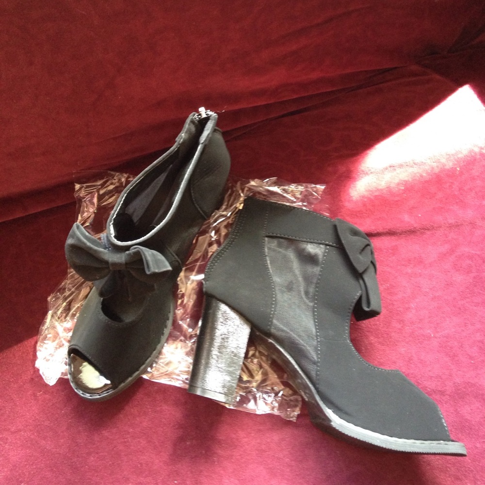 Sweet & sexy bootie, faux suede feel, mesh inset.