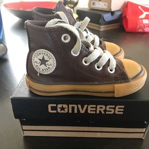 Brown leather converse