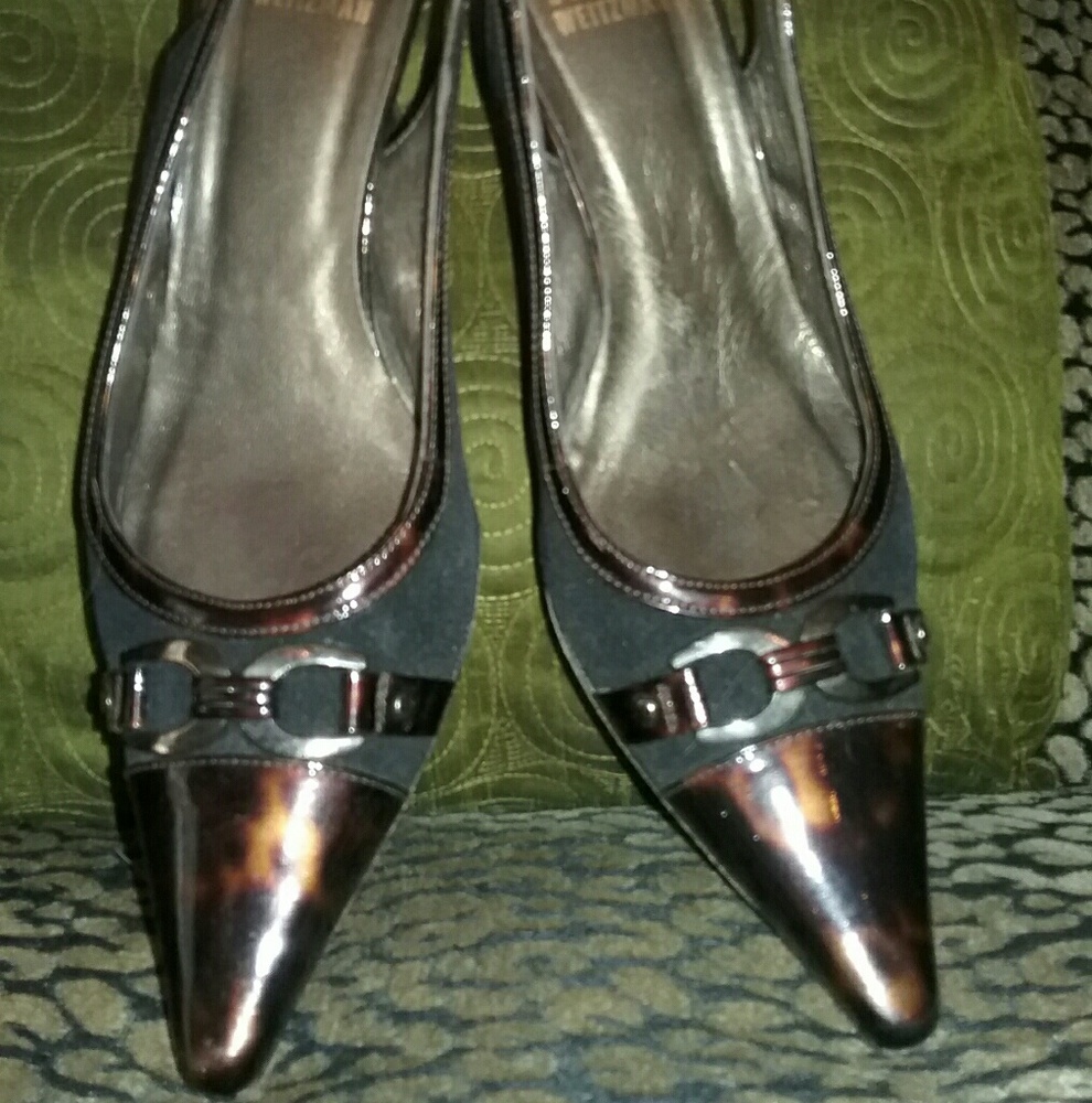 Stuart Weitzman tortoise and black kitten heels.