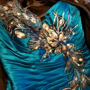 Teal peacock prom dress size 12