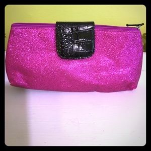 Hot pink sparkly handbag with snap closure