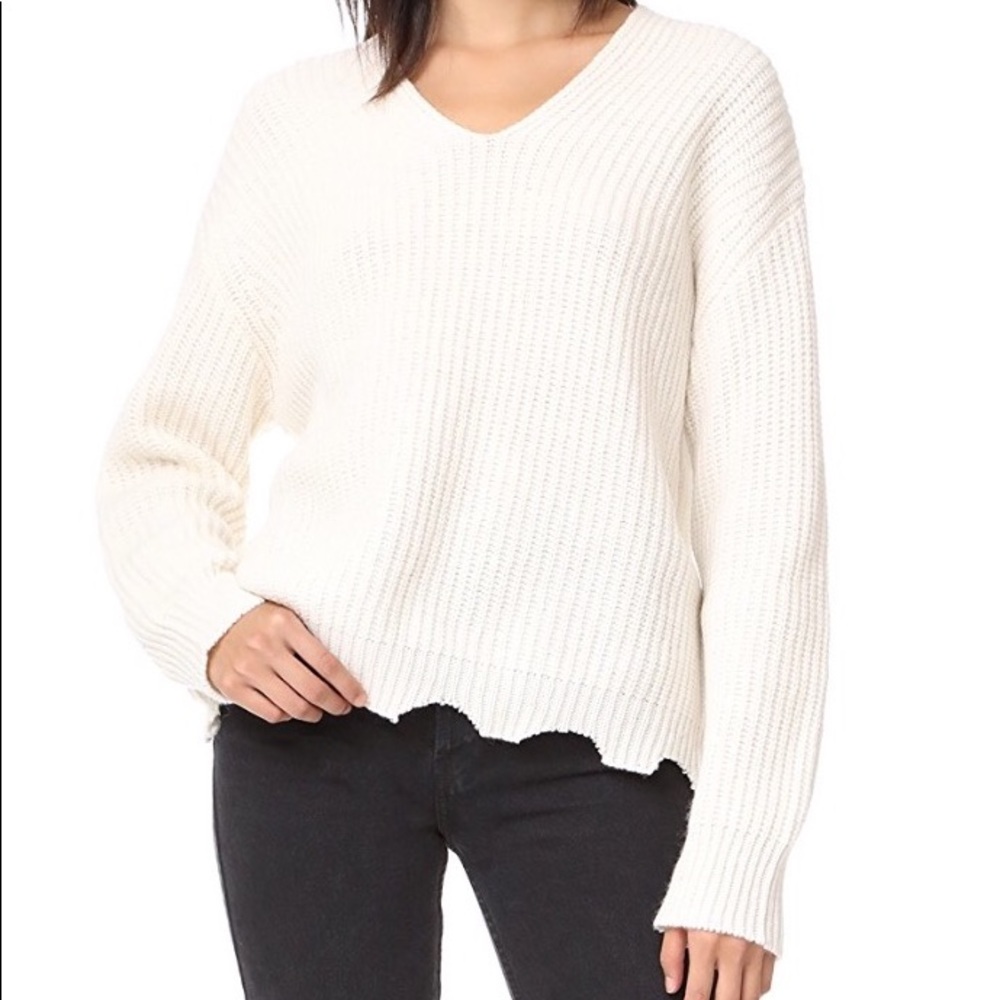 White jagged hem sweater