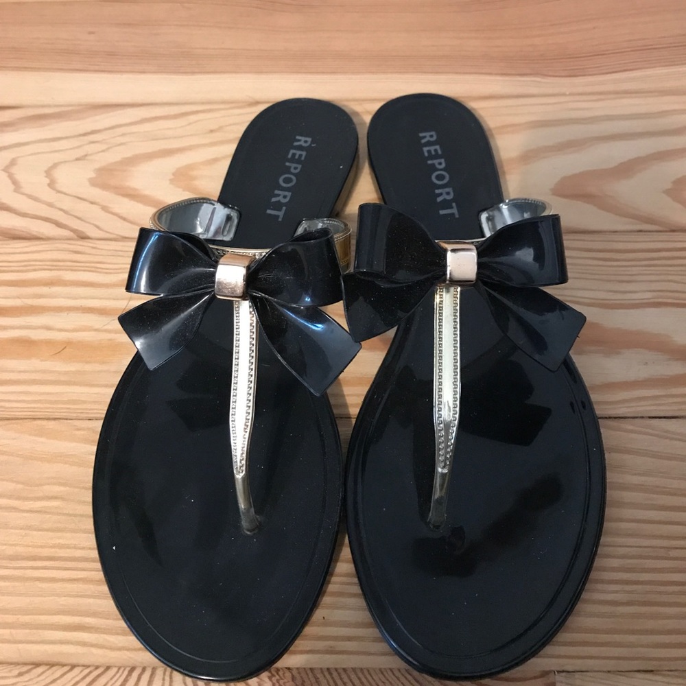 Black and gold bow flip flops