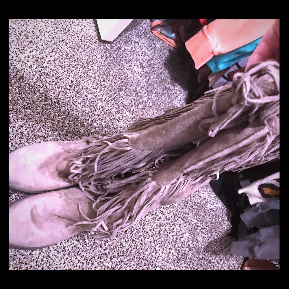 Knee high fringe boots
