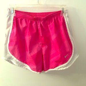 Bright pink Nike running shorts