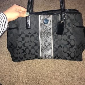 Black coach bag with snake skin accent