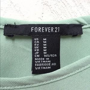 Mint green sheet tank blouse.