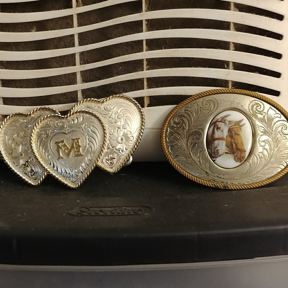 Two women Western belt buckles