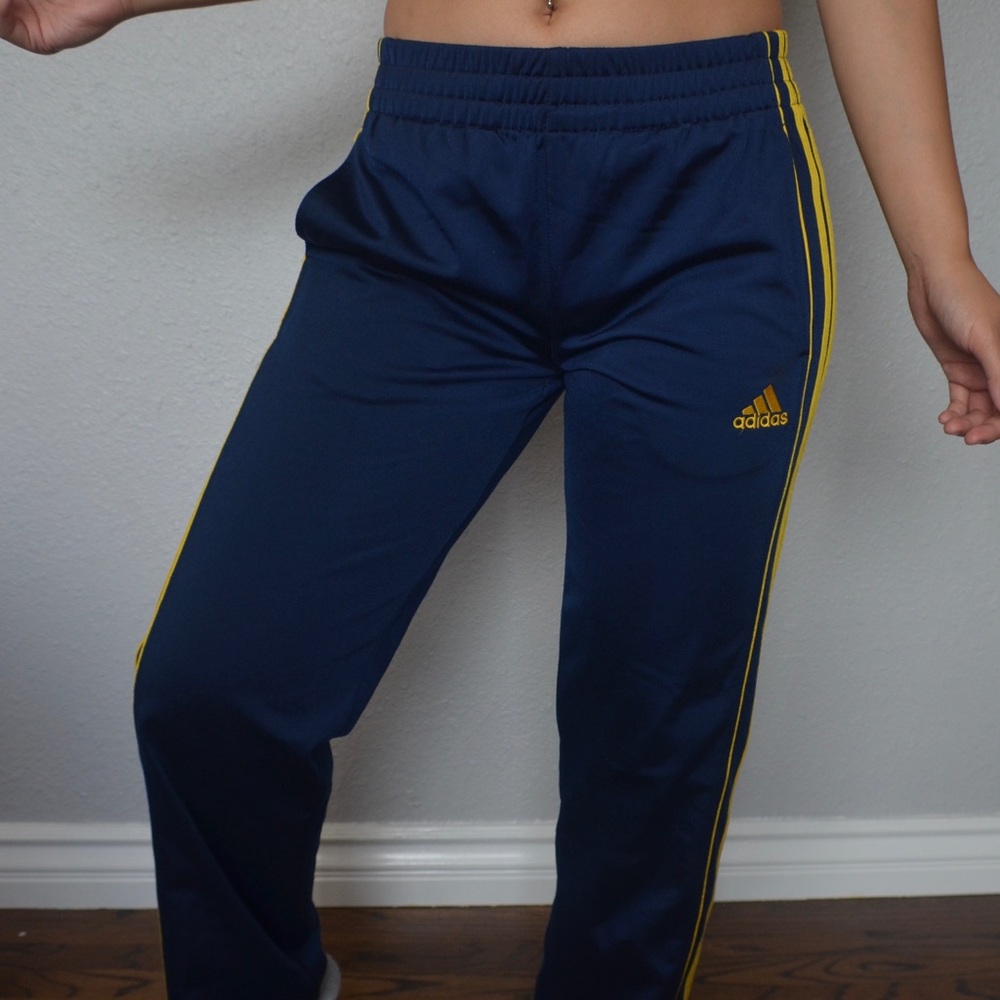 Dark blue and yellow Adidas Trackpants