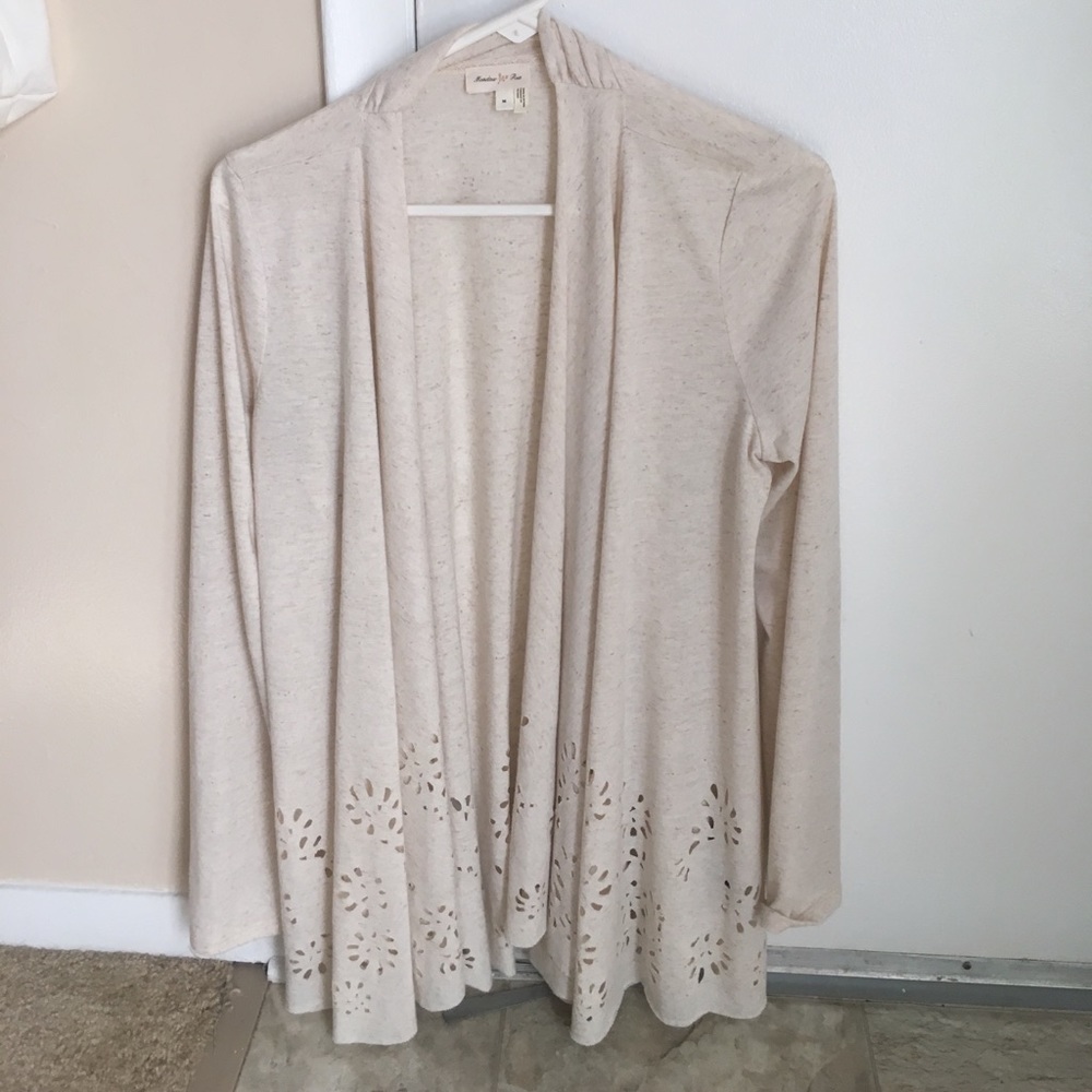 Cream cardigan with laser cut detail
