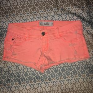 Neon orange Hollister jean shorts.