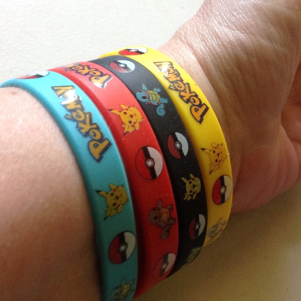 Lot of 4 Pokemon Go Wrist Bands-new
