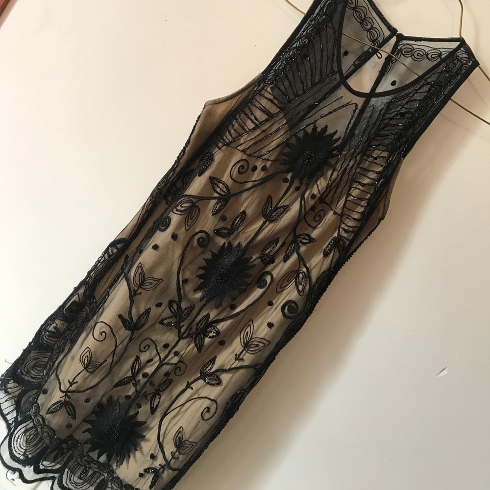 Black laced dress with beading.