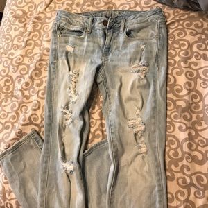 Light wash distressed skinny jeans