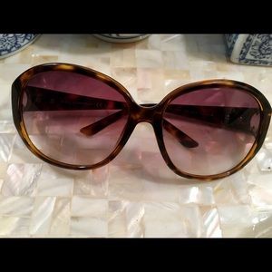 Gucci tortoiseshell glasses.