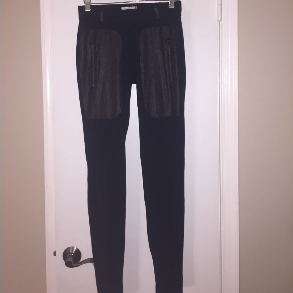 Black leggings with pleather pockets.