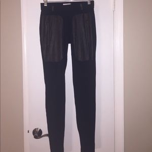 Black leggings with pleather pockets.