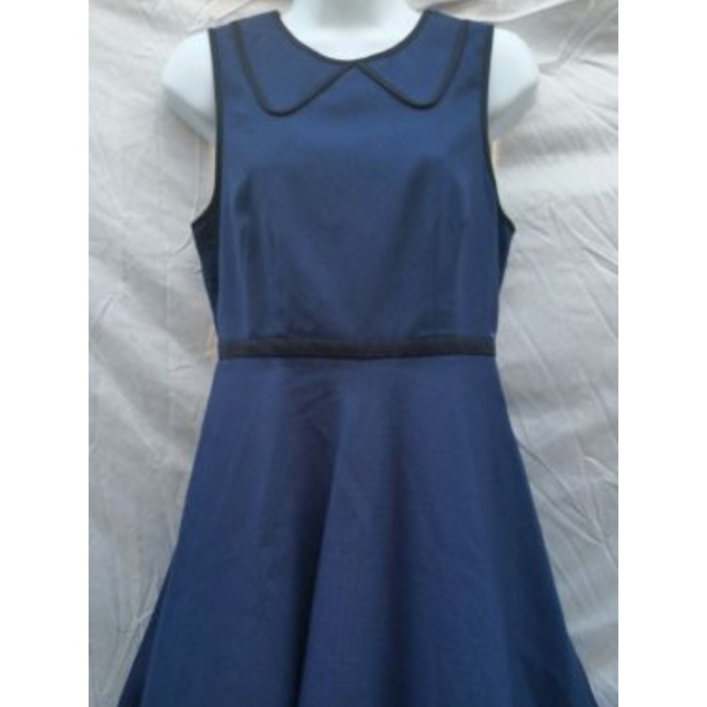 Navy polka dot with black Peter Pan collar trim