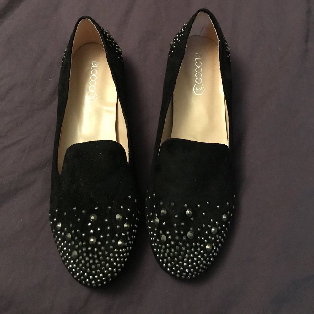 Rhinestone studded black suede flats.