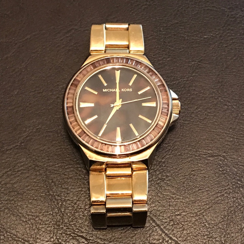 Gold Michael Kors cheetah face watch