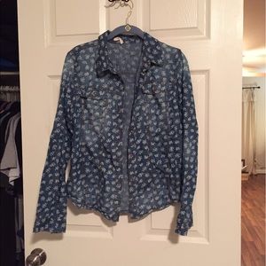 Jean shirt with white design in it