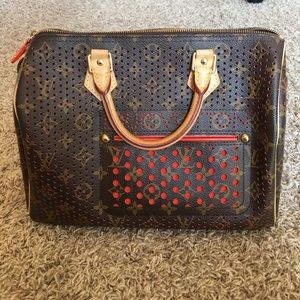 Louis Vuitton Orange Perforated Speedy 30 Bag.
