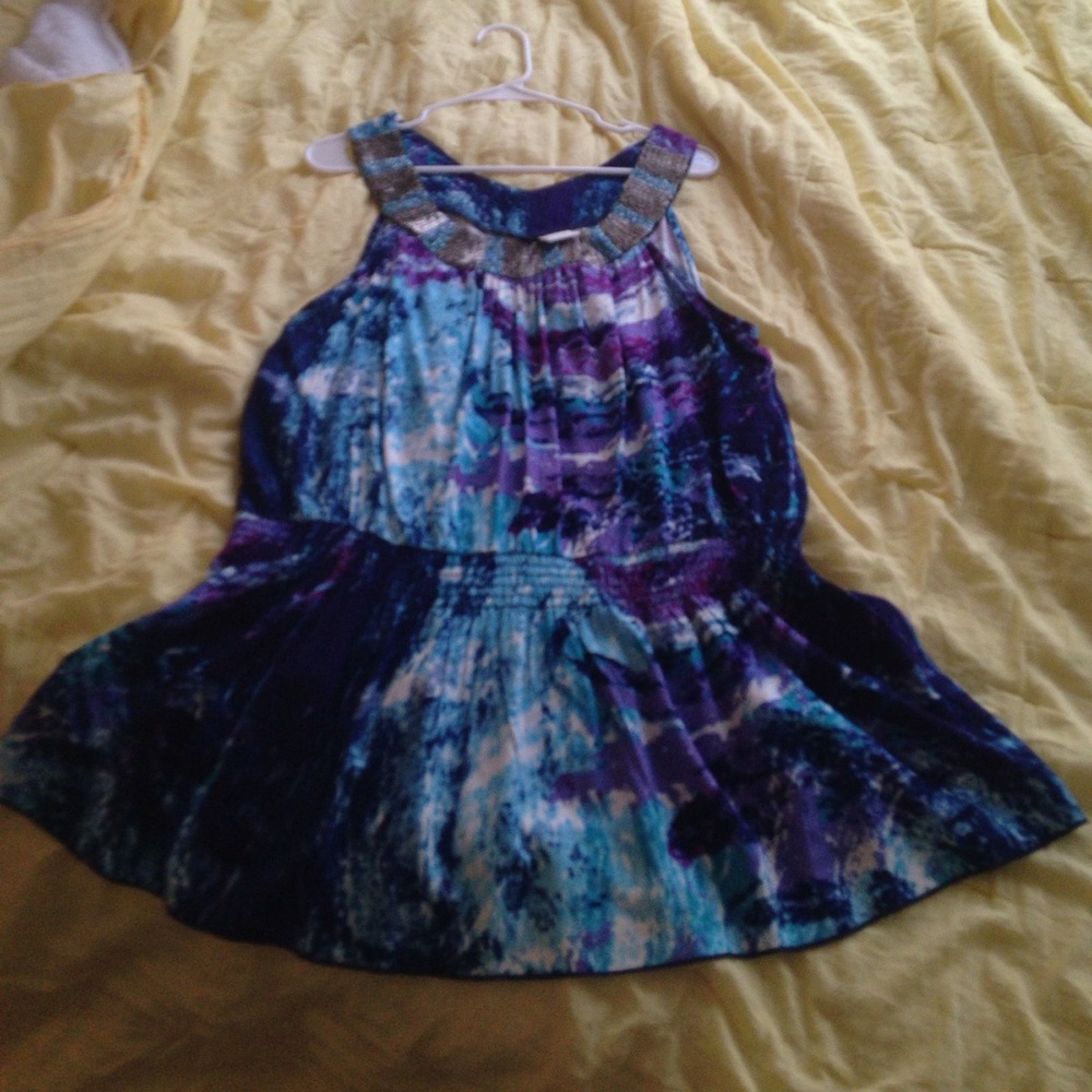 A beautiful beaded collar top.