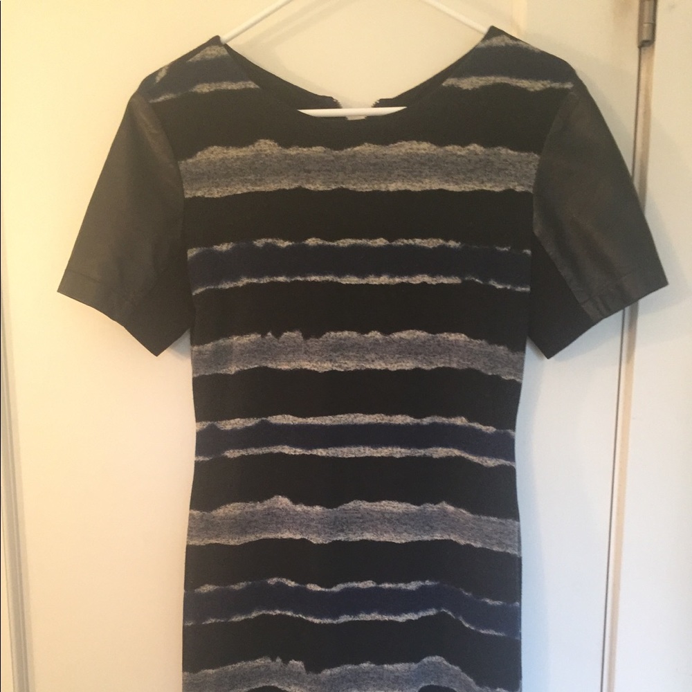 Striped dress with faux leather sleeves