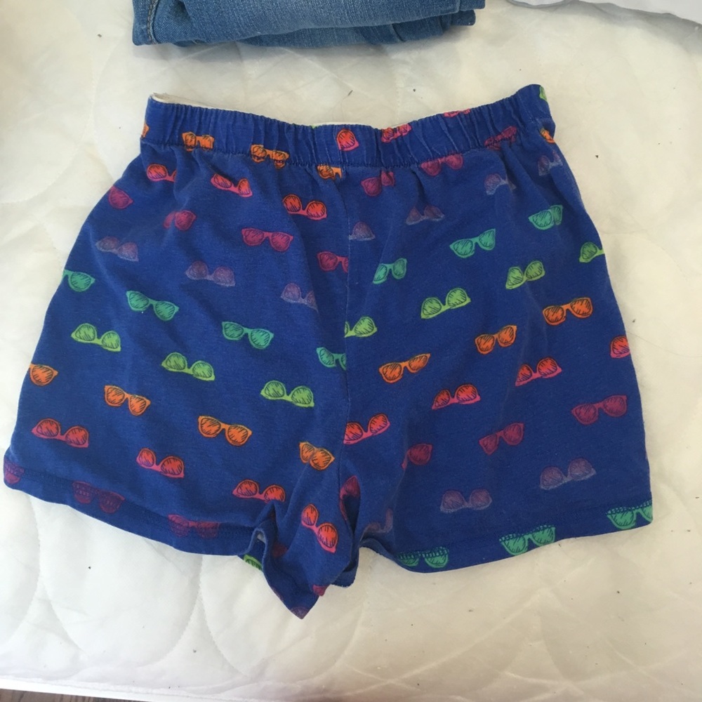 Blue Kids shorts w/sunglasses Design. Size 10/12.