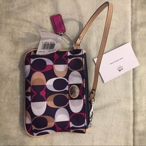 Coach wristlet never used! 2 card holders inside Coach wristlet never used! 2 card holders inside