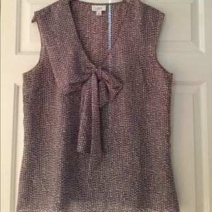 Cute sleeveless blouse with adorable bow!