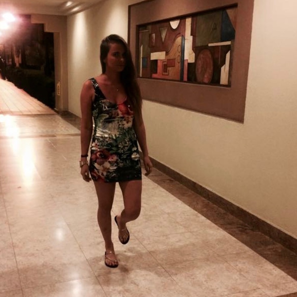 Short open back floral mini dress.