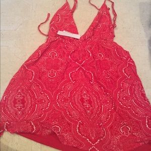 Glamorous ladies playsuit in red paisley