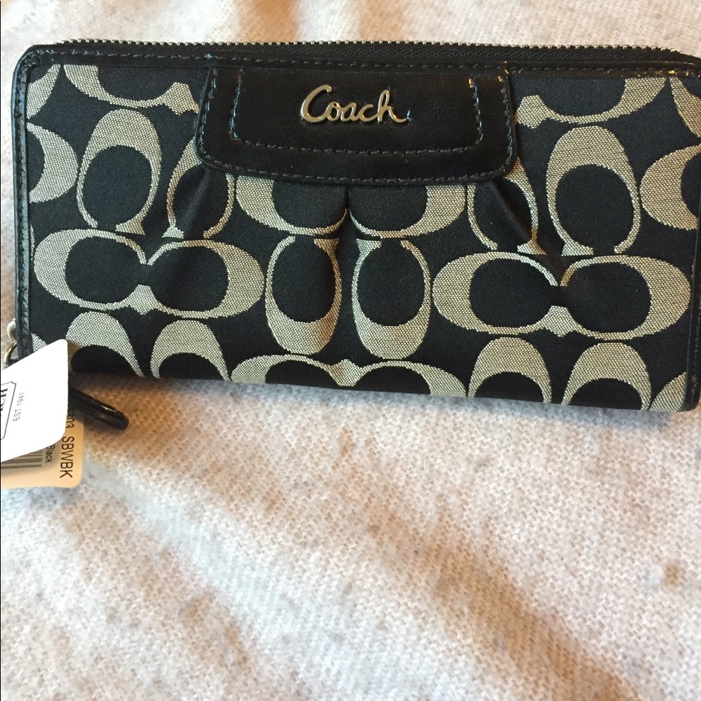 Coach signature zip around wallet. NWT